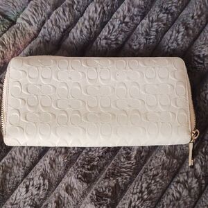 Elegant Coach Embossed Leather Cream Wallet